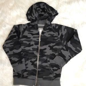 Camo pattern zip-up hoodie with pockets.